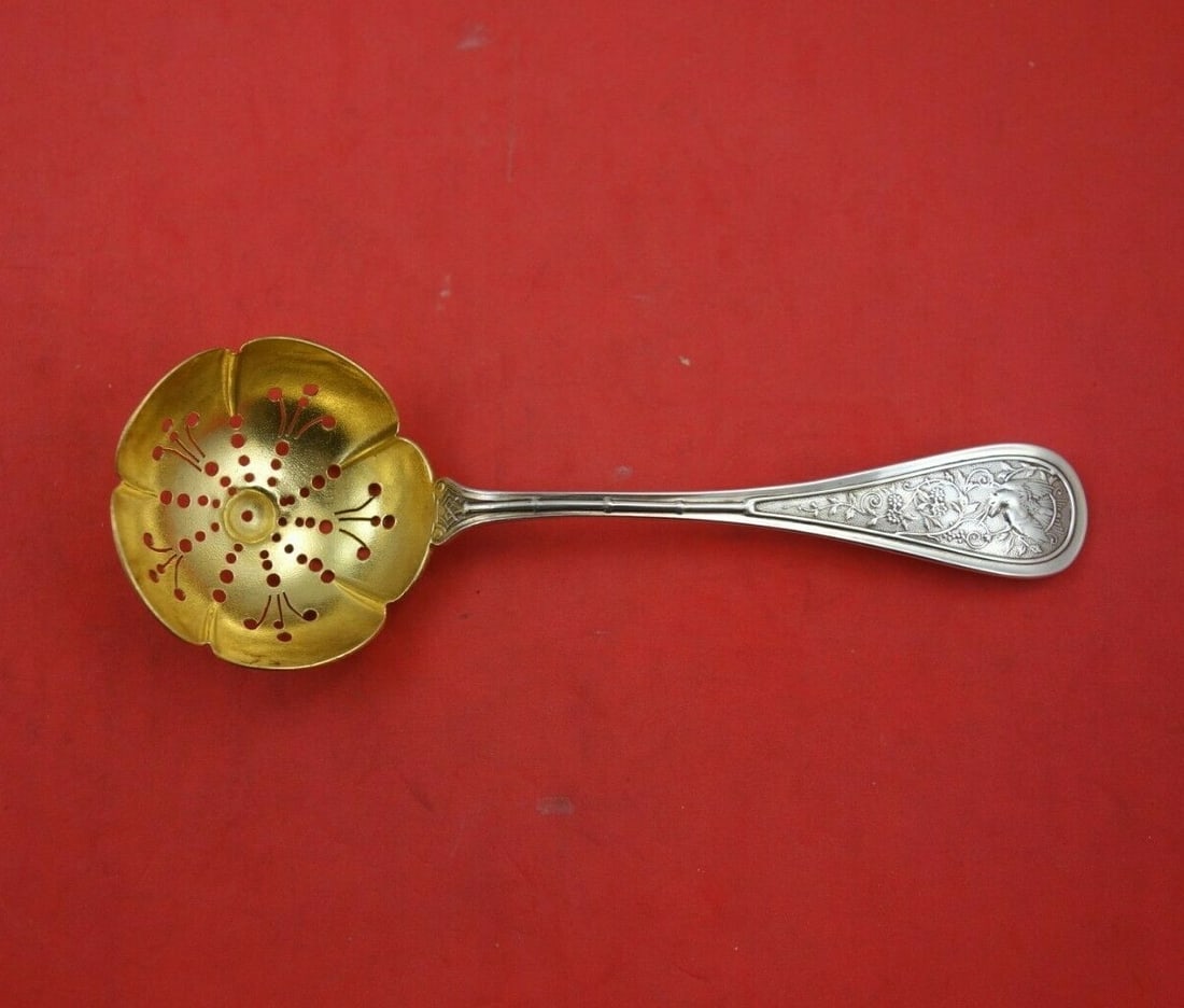 Wendt Sterling Silver Gold Washed Bird Motif Sugar Sifter 5 1/2 Inch: Wendt Sterling Silver Gold Washed Bird Motif Sugar Sifter 5 1/2 Inch This sterling silver sugar sifter features a gold-washed stipple finish and a bird motif pattern by Wendt. Measuring 5 1/2 inches, 