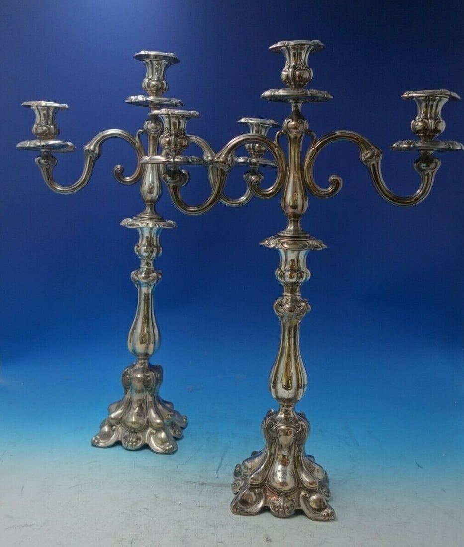 Hugo Bohm .800 Silver Candelabra Pair 3-Light 21.5 Inches Tall: Hugo Bohm .800 Silver Candelabra Pair 3-Light 21.5 Inches Tall This exquisite pair of three-light candelabras by Hugo Bohm showcases exceptional craftsmanship and elegance. Each candelabrum stands at 