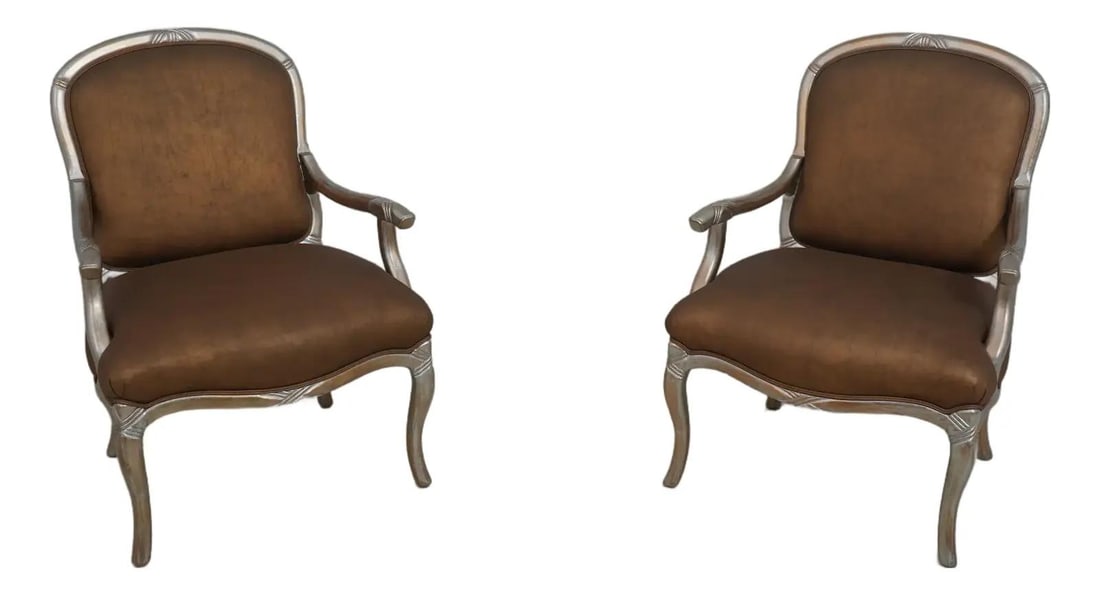 Elegant Pair of French Modern Silver Armchairs with Gold Accents: Elegant Pair of French Modern Silver Armchairs with Gold Accents Elevate your living space with this exquisite pair of French modern design armchairs. These custom upholstered chairs feature a stunnin