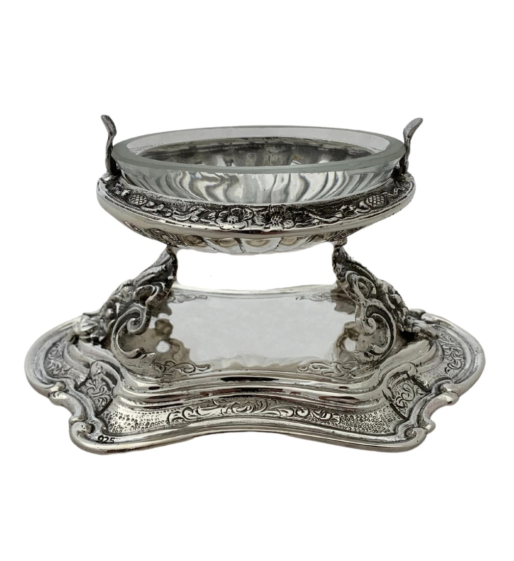 Handmade Sterling Silver and Crystal Oval Salt Holder with Stand: Handmade Sterling Silver and Crystal Oval Salt Holder with Stand This elegant salt holder features a fine 925 sterling silver body with a crystal insert. The piece showcases handmade chased ornate ova