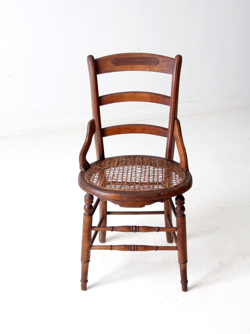 Vintage Victorian Cane Seat Chair French Country Style: Vintage Victorian Cane Seat Chair French Country Style This antique Victorian cane seat chair embodies a classic French country style, featuring a sturdy wooden frame complemented by a ladder back des