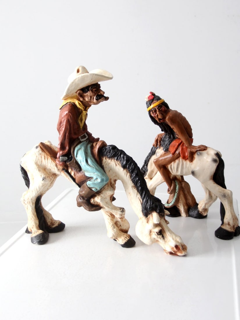 1970s Universal Statuary Cowboy Sheriff and Native American Statues Pair: 1970s Universal Statuary Cowboy Sheriff and Native American Statues Pair This striking pair of Universal Statuary statues from the 1970s captures the essence of the American West. Featuring an old cow
