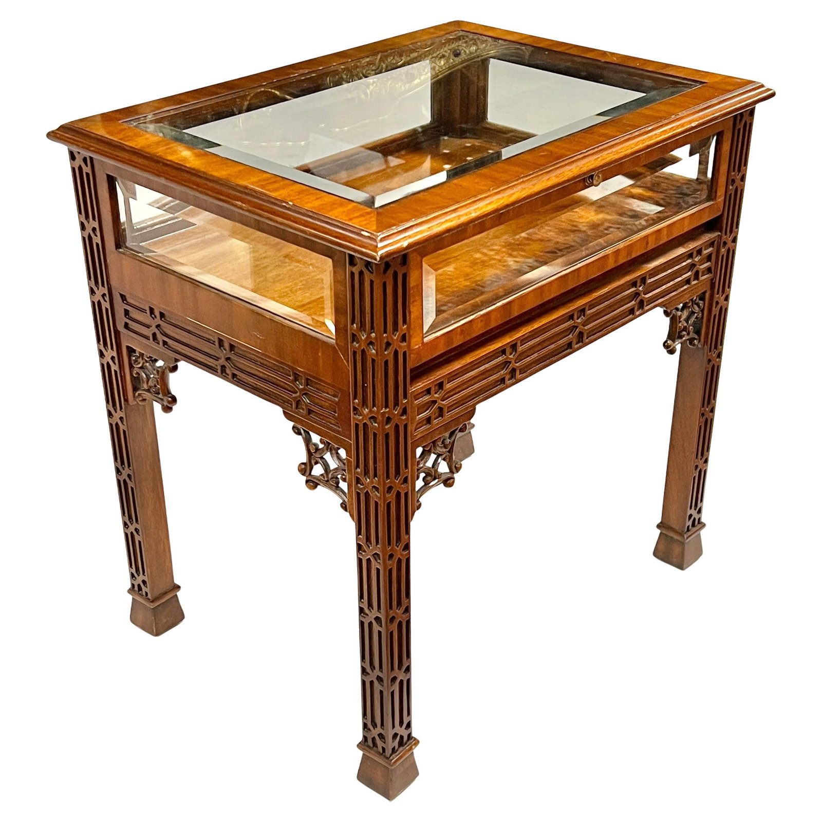 Chippendale Mahogany Glass Curio Table with Drop Front Panel: Chippendale Mahogany Glass Curio Table with Drop Front Panel This elegant curio display table by Maitland Smith features a classic English Chippendale Georgian style. Crafted from mahogany with facete