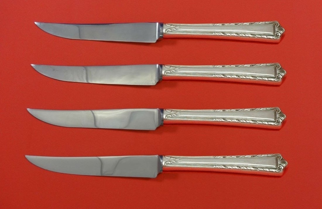 International Sterling Processional 4pc Steak Knife Set Custom Silver: International Sterling Processional 4pc Steak Knife Set Custom Silver This exquisite 4-piece steak knife set features the elegant "Processional" pattern by International Sterling. Crafted from high-qu