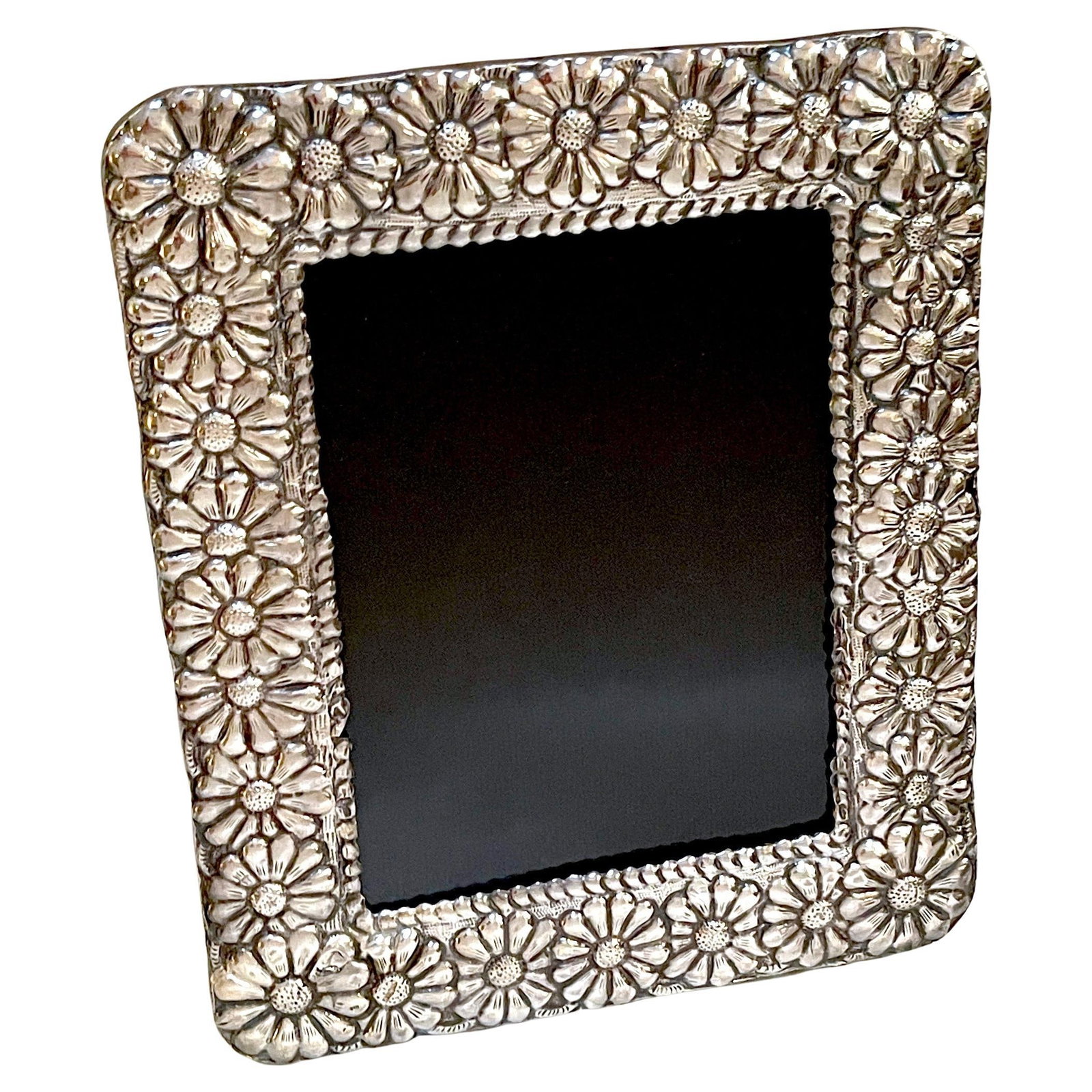 1960s Modern Sterling Silver Taxco Picture Frame with Floral Design: 1960s Modern Sterling Silver Taxco Picture Frame with Floral Design This exquisite Modern Sterling Taxco School Picture Frame showcases a stunning design with a continuous surround of repoused flower-