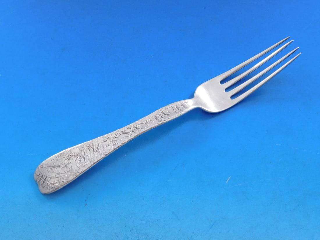 Tiffany Co Lap Over Edge Sterling Silver Fork Cicada 7 1/4 inch: Tiffany Co Lap Over Edge Sterling Silver Fork Cicada 7 1/4 inch This exquisite sterling silver fork features the Lap Over Edge pattern by Tiffany & Co., showcasing a striking cicada motif resting on l