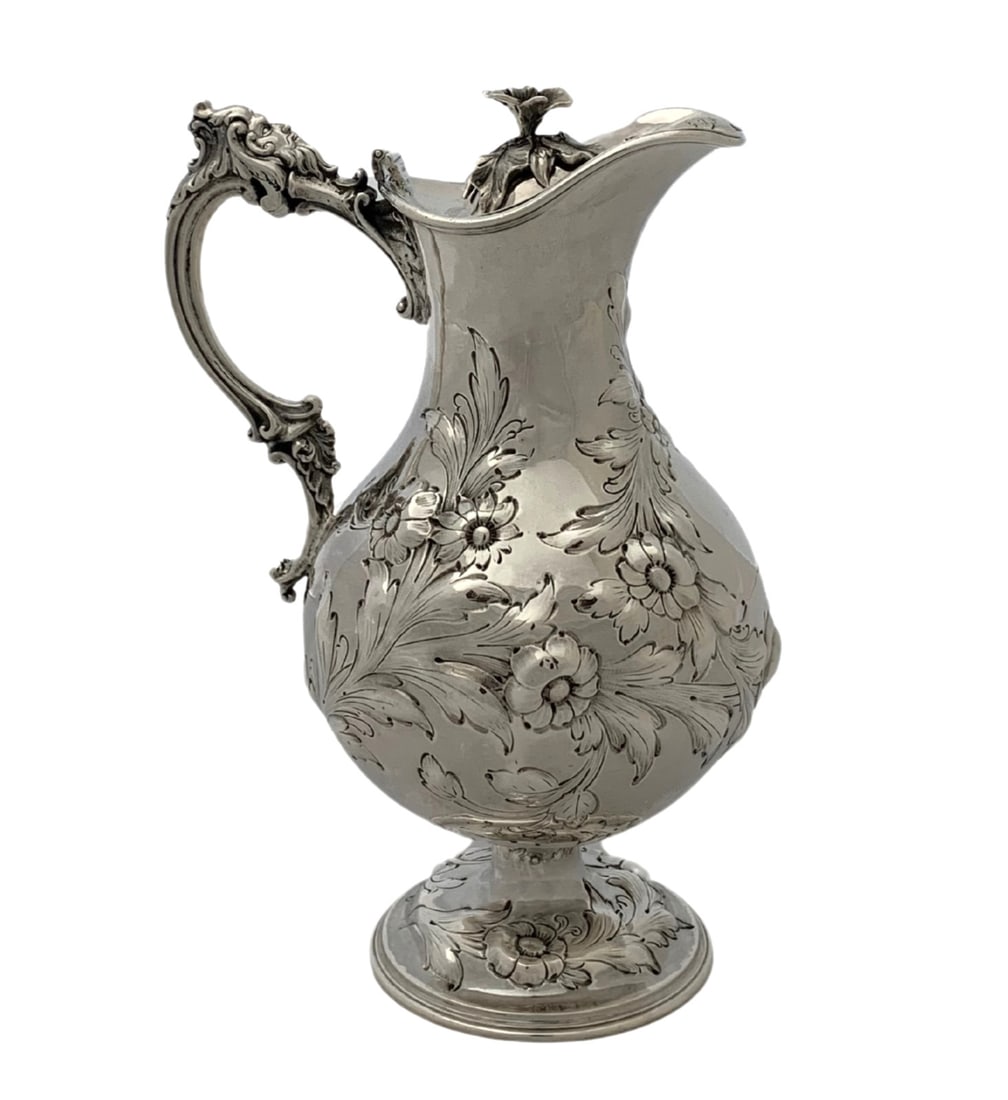 Antique Bailey & Co Sterling Silver Floral Leaf Swirl Pitcher 8.25": Antique Bailey & Co Sterling Silver Floral Leaf Swirl Pitcher 8.25" This exquisite antique pitcher from Bailey & Co. is crafted from sterling silver, showcasing intricate handmade engraved floral leaf