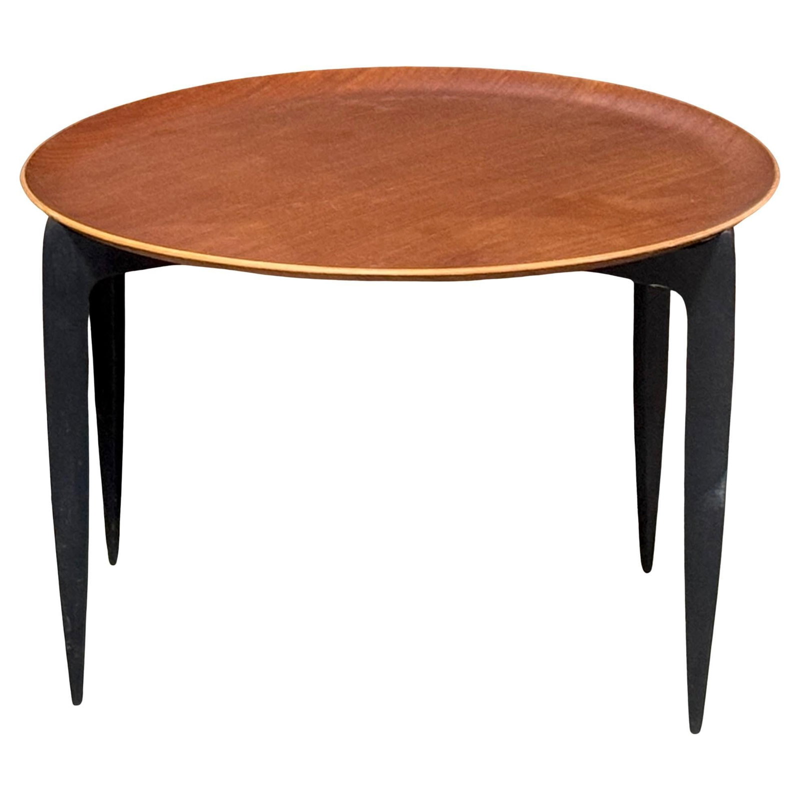 Fritz Hansen Danish Teak Ebonized Circular Tray Table 1960s: Fritz Hansen Danish Teak Ebonized Circular Tray Table 1960s Discover the timeless elegance of the Danish Teak & Ebonized Circular Campaign Tray Tables by Fritz Hansen, crafted in the 1960s. These vers