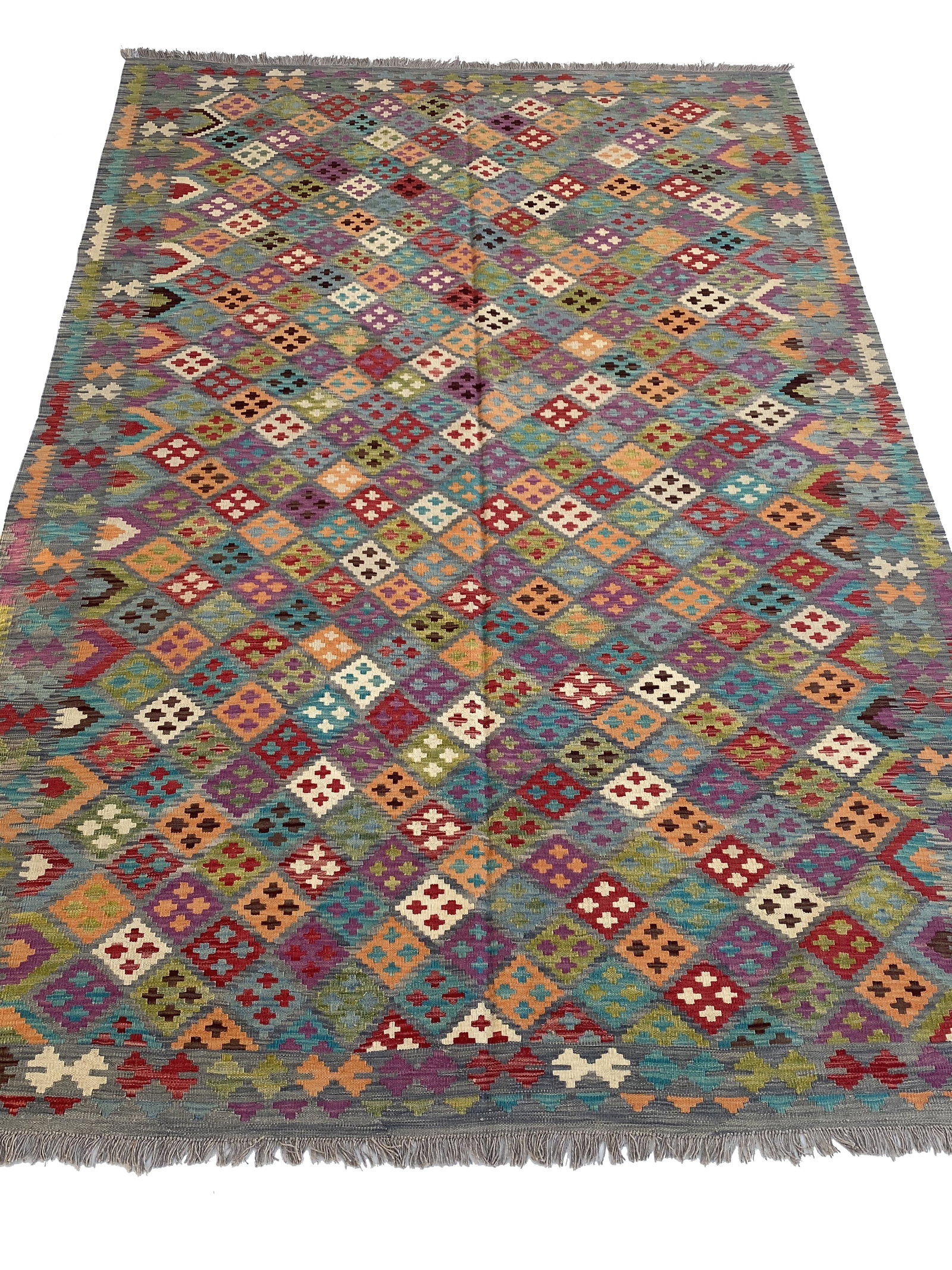 6x10 Handwoven Multi-Color Red Tribal Kilim Rug from Afghanistan: 6x10 Handwoven Multi-Color Red Tribal Kilim Rug from Afghanistan Free continental US Shipping Transform your living space with the stunning 6' x 10' Multi-Color Red Kilim Rug, a perfect blend of tradi