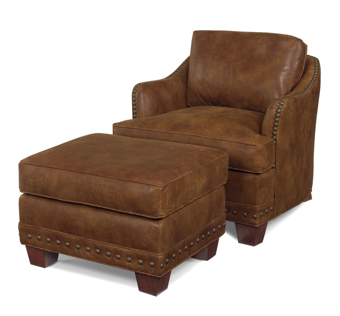 Handcrafted Almond Leather Ottoman 19H 28.5W 24D: Handcrafted Almond Leather Ottoman 19H 28.5W 24D Experience the elegance of this Luxurious Handcrafted Almond Leather Ottoman, designed with a striking pyramid leg shape. This exquisite piece is hand-