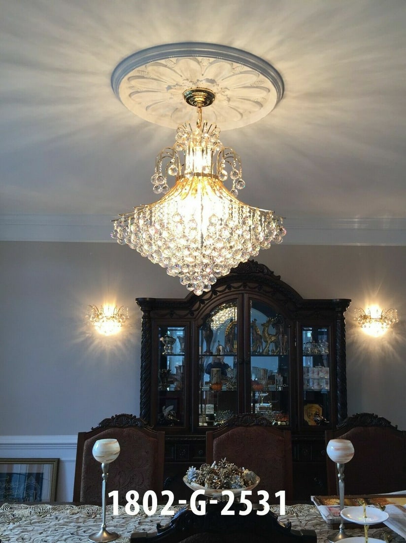 Toureg 15-Light Gold Crystal Chandelier for Dining or Foyer 31 Inch Height: Toureg 15-Light Gold Crystal Chandelier for Dining or Foyer 31 Inch Height This modern chandelier from the Toureg Collection features a gold-finish frame adorned with high-quality Grand King K9 crysta