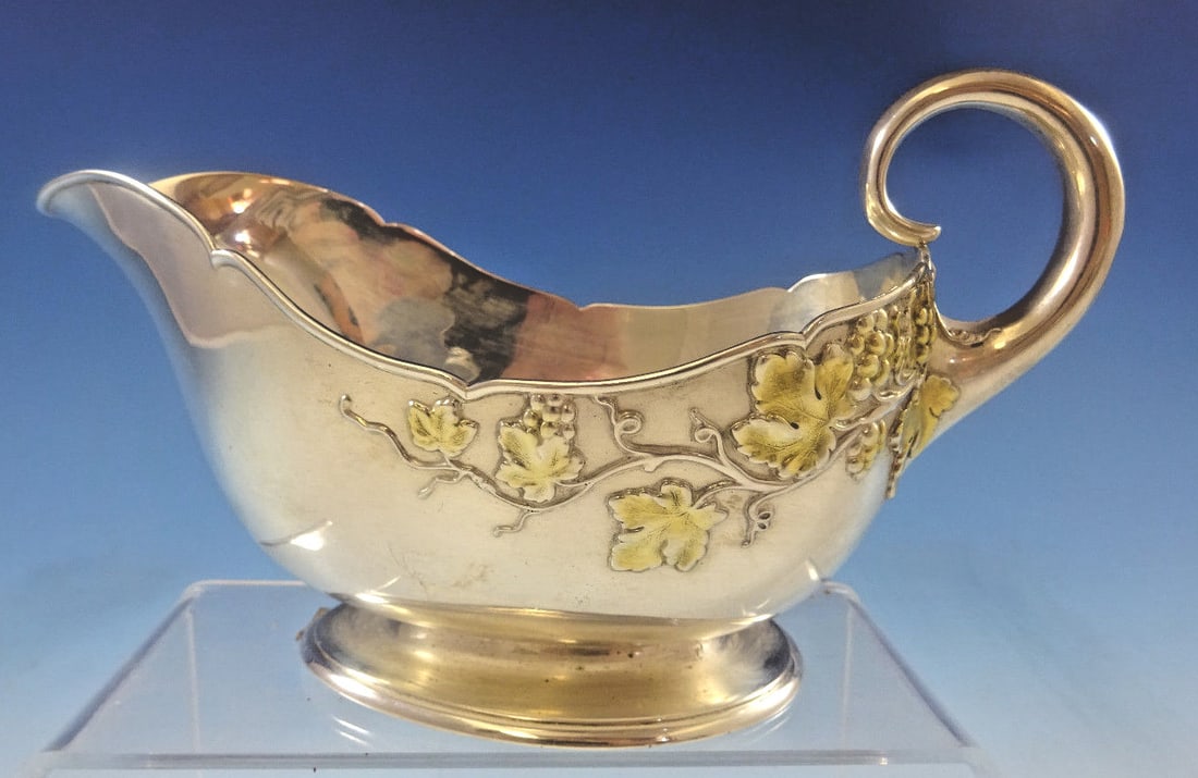 Tiffany & Co. Sterling Silver Gravy Boat Grape Vine Motif 1892-1902: Tiffany & Co. Sterling Silver Gravy Boat Grape Vine Motif 1892-1902 Experience the elegance of this exquisite sterling silver gravy boat from Tiffany & Co., adorned with a beautiful grape vine motif f