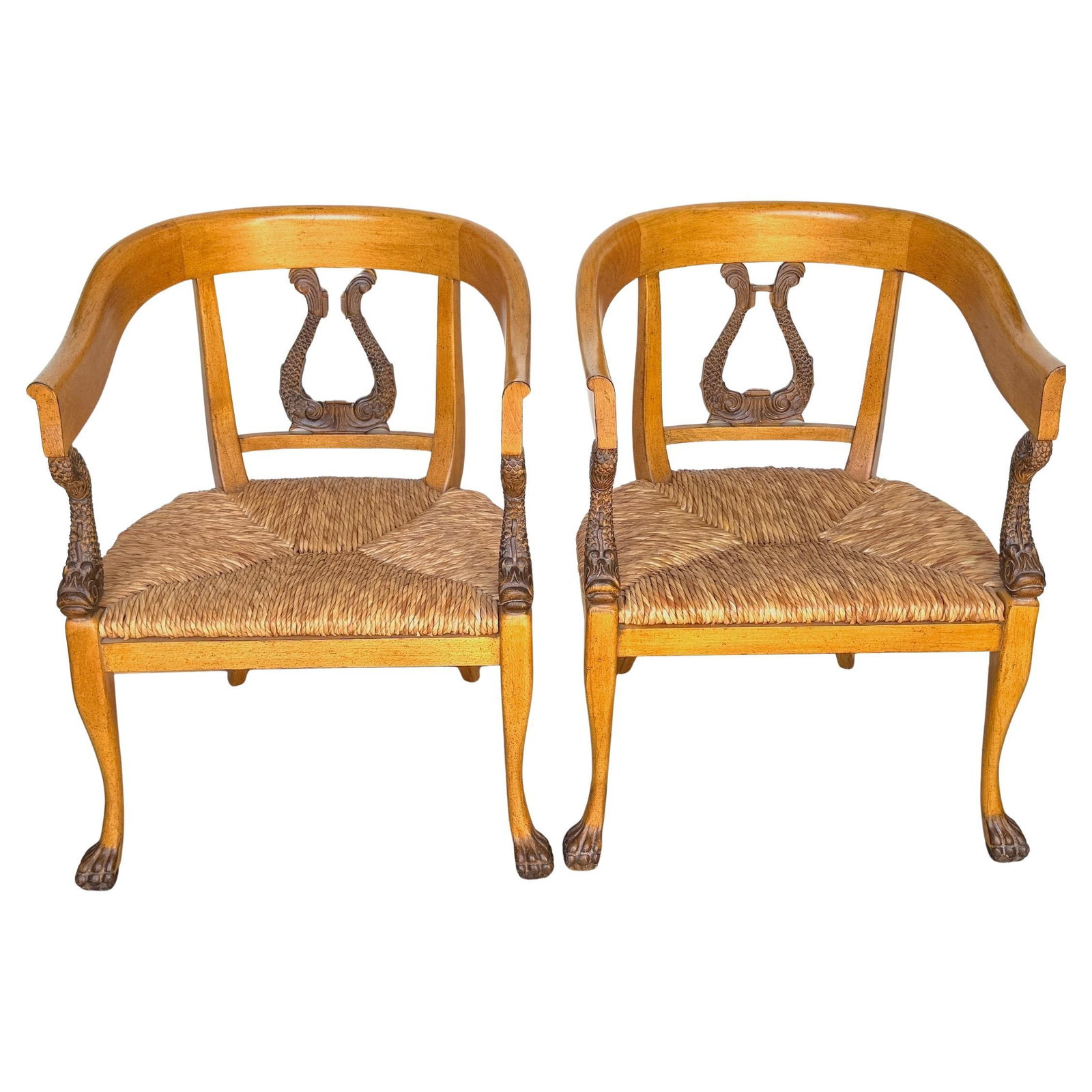 Set of 2 Italian Neoclassical Dolphin Armchairs With Rush Seats Late 20th Century: Set of 2 Italian Neoclassical Dolphin Armchairs With Rush Seats Late 20th Century This pair of Italian Neoclassical armchairs from the late 20th century is crafted from solid fruitwood with a warm, ho