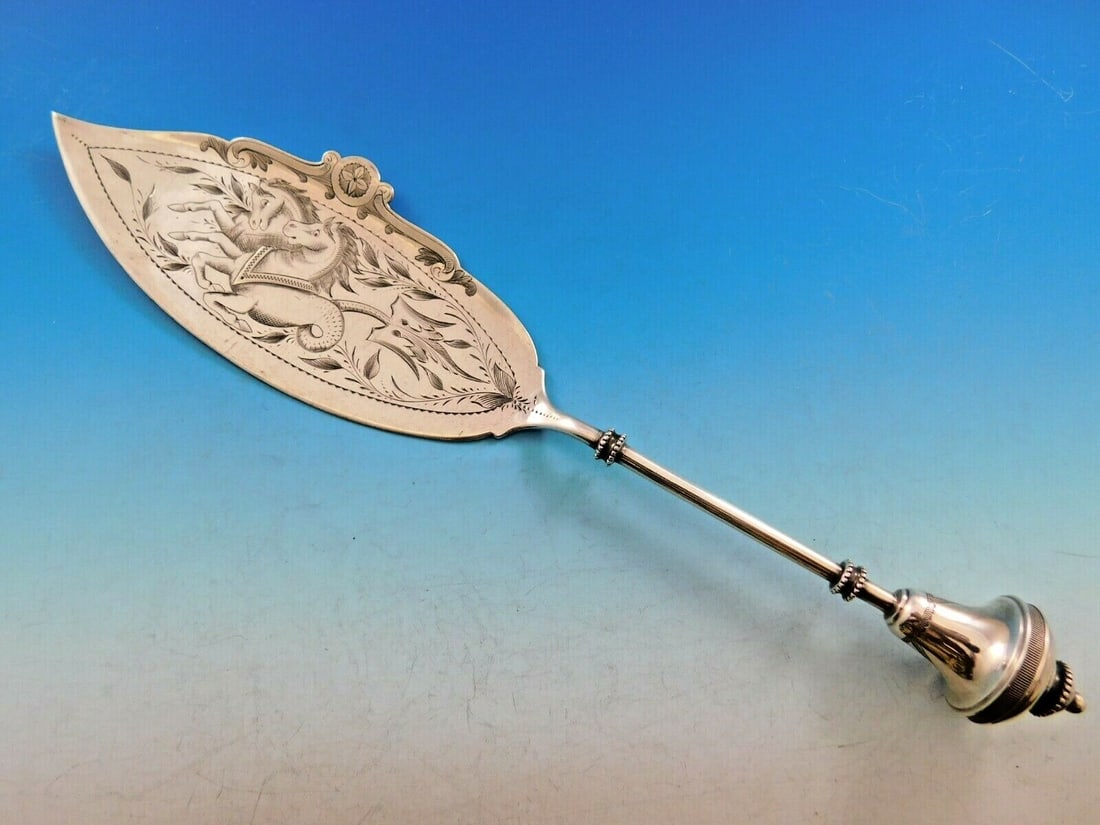 Antique Sterling Silver Fish Server 1860-1883 Hippokampoi Design: Antique Sterling Silver Fish Server 1860-1883 Hippokampoi Design This exquisite sterling silver fish server, crafted between 1860 and 1883, showcases a beautiful brite-cut design depicting hippokampoi