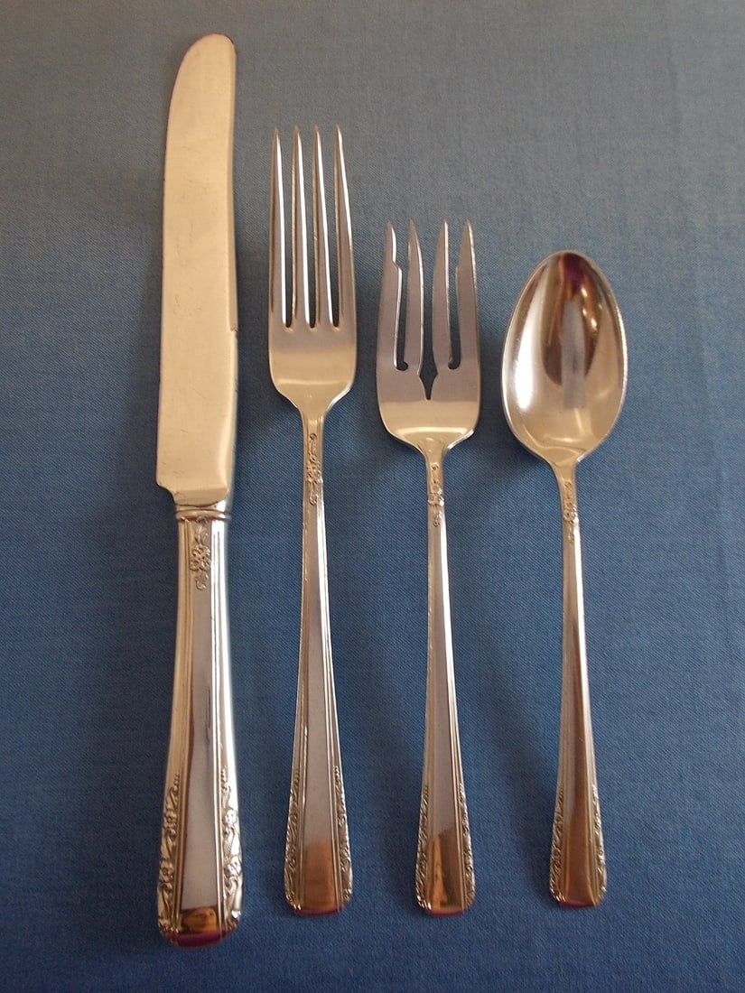 International Sterling Silver Courtship 4-Piece Vintage Place Setting: International Sterling Silver Courtship 4-Piece Vintage Place Setting Introducing the Vintage Courtship 4-Piece Place Setting by International Sterling Silver, a beautiful heirloom piece from the earl