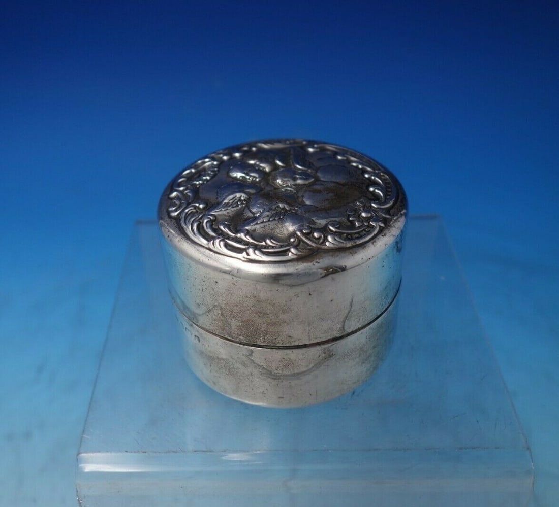 Levi & Salaman Sterling Silver Box with Cherubs 1900-1940: Levi & Salaman Sterling Silver Box with Cherubs 1900-1940 This exquisite sterling silver box from Levi & Salaman showcases a stunning design featuring winged cherubs. Crafted in Birmingham, England, b