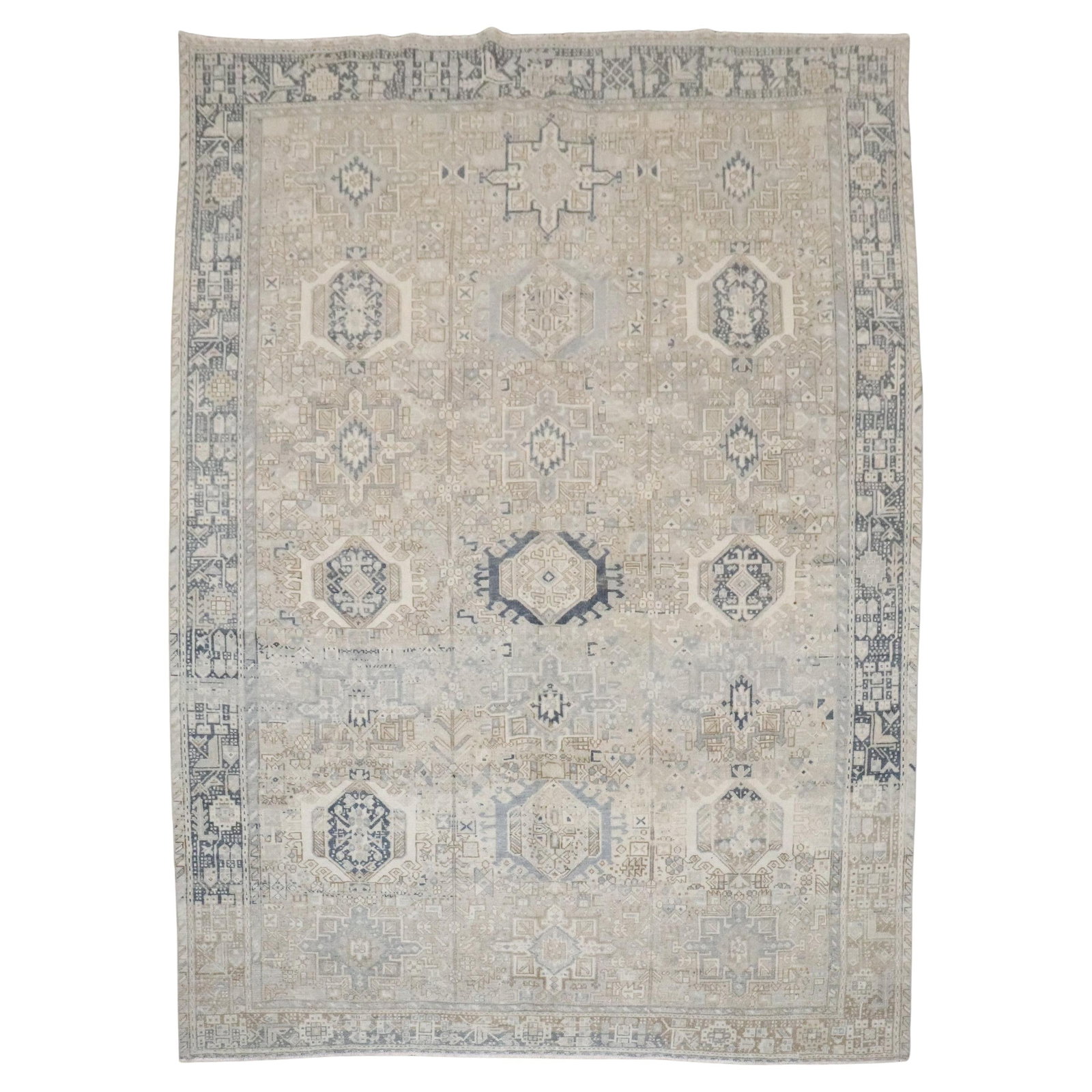 Heriz Serapi Persian Wool Rug Early 20th Century 8'1" x 10'8": Heriz Serapi Persian Wool Rug Early 20th Century 8'1" x 10'8" This vintage Persian Heriz Karadja rug from the early 20th century features a neutral color palette and is hand-woven from wool. Its class