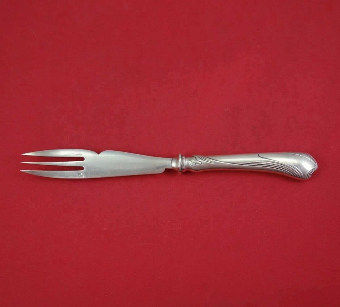 Christofle Moderne Gramont Sterling Silver Melon Fork 8 3/8": Christofle Moderne Gramont Sterling Silver Melon Fork 8 3/8" This exquisite Moderne Gramont Melon Fork is crafted by Christofle, renowned for its fine silverware. Featuring a stunning sterling silver 
