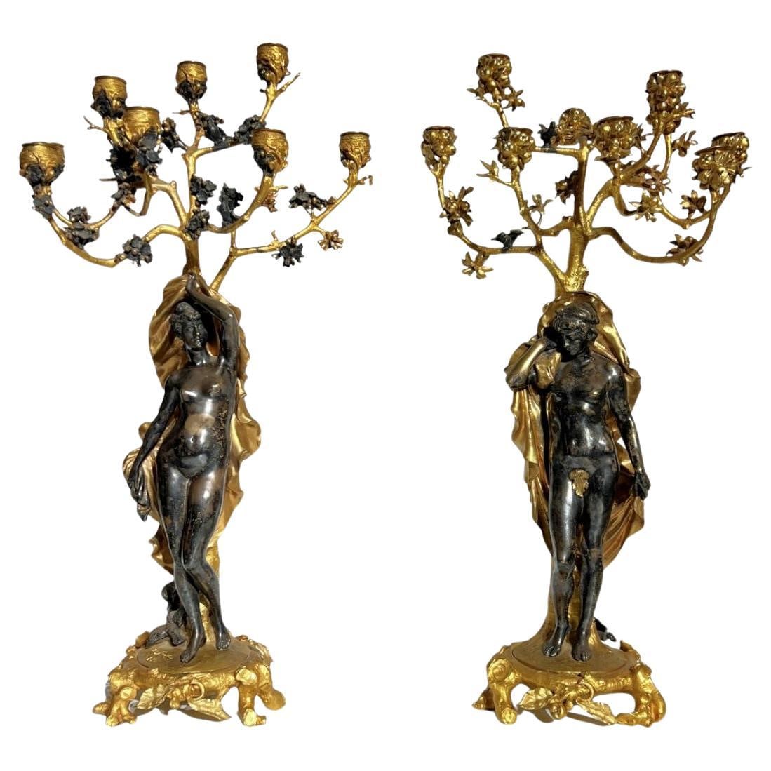 Set of Two Neoclassical French Silvered and Gilt Bronze Candelabra by Judith Gautier: Set of Two Neoclassical French Silvered and Gilt Bronze Candelabra by Judith Gautier This pair of exceptional late 19th century French neoclassical revival candelabras is crafted from gilt and silvere