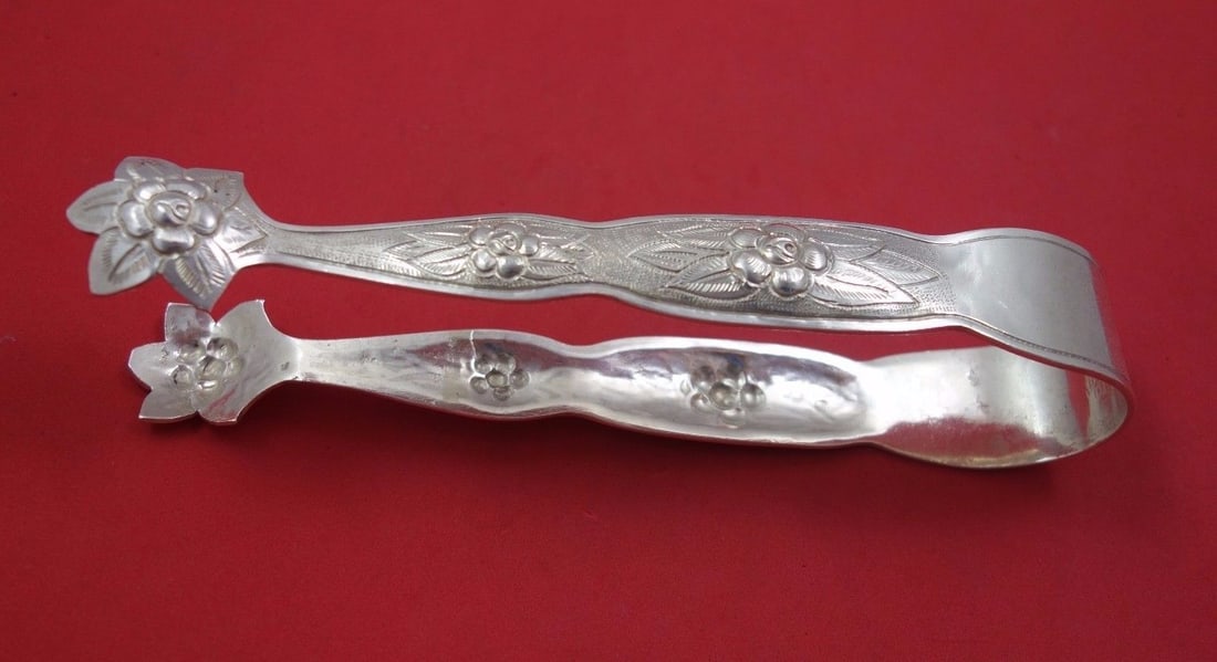 Sanborns Aztec Rose Sterling Silver Ice Tong 5.5oz 7 7/8in: Sanborns Aztec Rose Sterling Silver Ice Tong 5.5oz 7 7/8in This exquisite Aztec Rose ice tong by Sanborns showcases a beautiful design in sterling silver. Weighing 5.5 ounces, it measures 7 7/8 inches