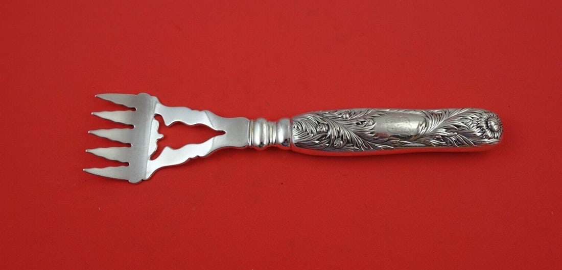 Sterling Silver Pierced Trout Fork 8 Inch Chrysanthemum Pattern: Sterling Silver Pierced Trout Fork 8 Inch Chrysanthemum Pattern This is a Tiffany & Co. Chrysanthemum pattern sterling silver trout serving fork featuring a hollow handle, all-sterling construction, a