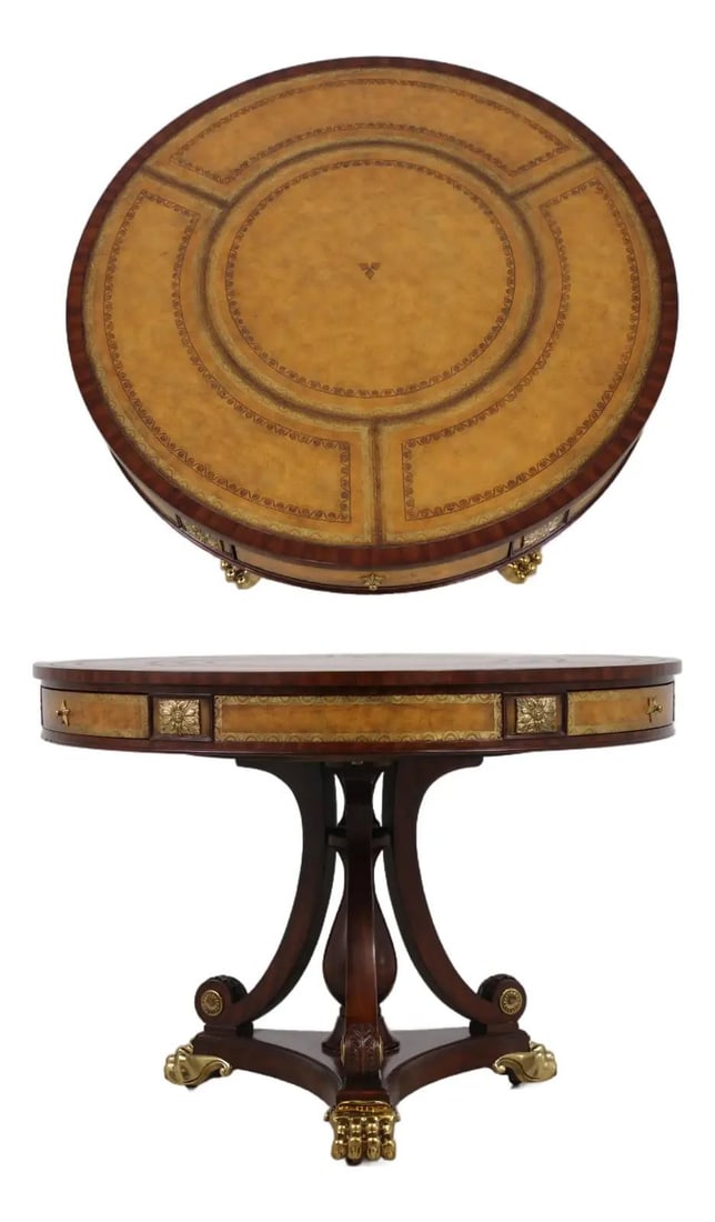 Regency Style Mahogany Center Table with Leather Top and Brass Mounts: Regency Style Mahogany Center Table with Leather Top and Brass Mounts This Maitland Smith round center table features a Regency style design with a high-quality mahogany frame. The tabletop and drawer
