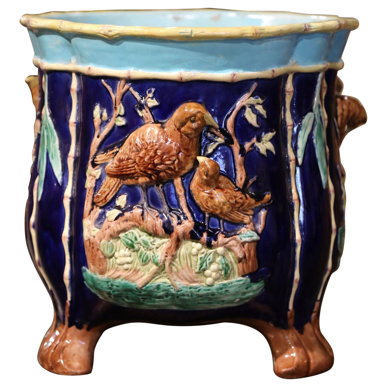 French Majolica Bird Motif Ceramic Cache Pot Circa 1860: French Majolica Bird Motif Ceramic Cache Pot Circa 1860 This mid-19th century French cache pot is crafted from hand-painted Majolica ceramic. Created around 1860, it features a round, bombe body suppo