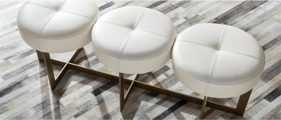 John-Richard Mid-Century Modern White Leather Bench Seats 3: John-Richard Mid-Century Modern White Leather Bench Seats 3 Elevate your space with this luxurious three-seat bench, expertly crafted to embody a vintage style. This bench features a stunning white le