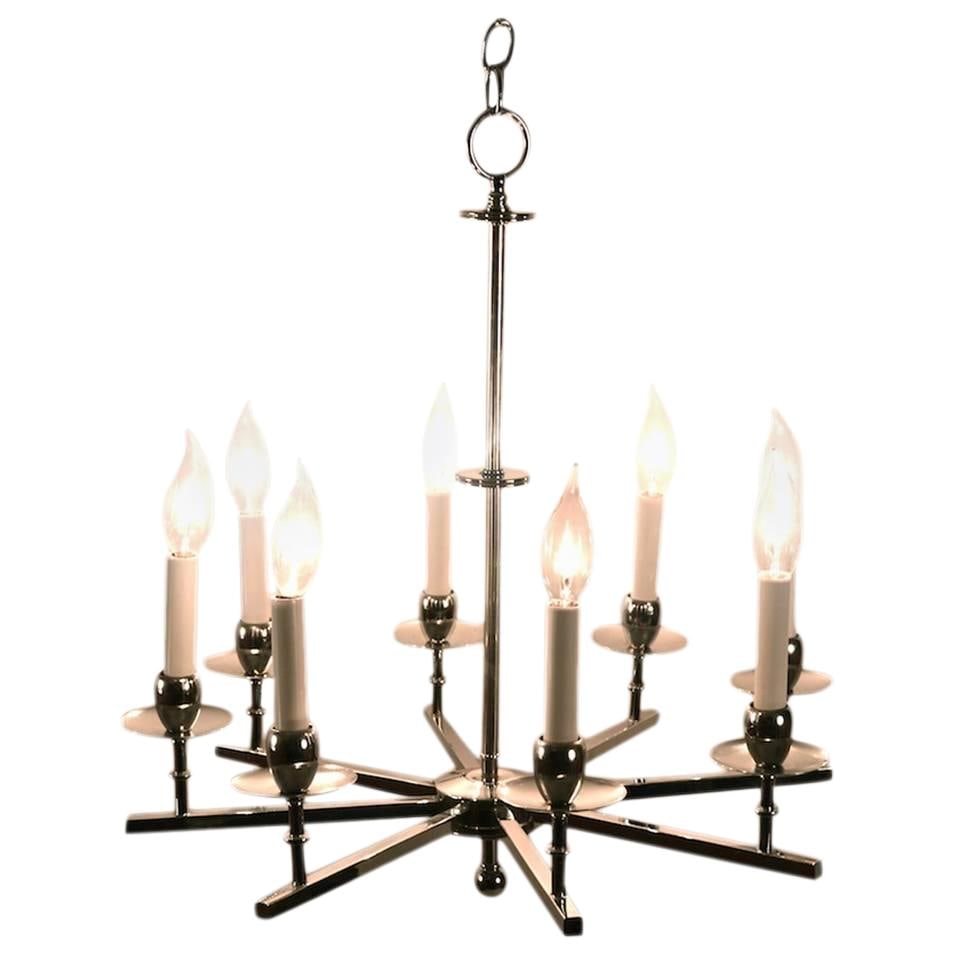 Sleek Chrome Eight-Light Spoke Chandelier with Chain: Sleek Chrome Eight-Light Spoke Chandelier with Chain Illuminate your space with this stunning Chrome Eight-Light Spoke Chandelier. Featuring a sleek design in bright chrome, this chandelier offers an 