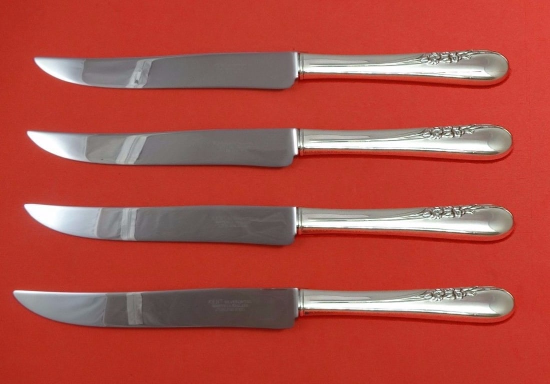 International Blossom Time 4-Piece Sterling Silver Steak Knife Set Texas Size: International Blossom Time 4-Piece Sterling Silver Steak Knife Set Texas Size Introducing the Blossom Time Steak Knife Set by International Sterling, a stunning collection of four custom-made knives d