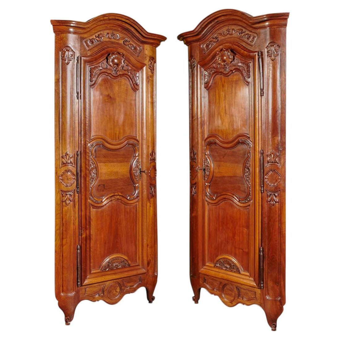 Set of Two French Walnut Louis XV Encoignure Cabinets with 18th Century Carved Doors: Set of Two French Walnut Louis XV Encoignure Cabinets with 18th Century Carved Doors This elegant pair of French Louis XV corner cabinets, known as encoignures, features 18th-century carved doors orig