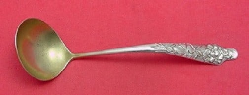 Shiebler Flora Sterling Silver Gold Washed Sauce Ladle 5 3/4": Shiebler Flora Sterling Silver Gold Washed Sauce Ladle 5 3/4" This exquisite ladle features the Flora pattern by Shiebler, showcasing a stunning multi-motif design with at least 15 different flowers. 