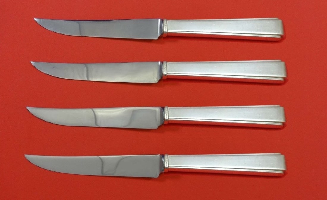 Lunt Modern Classic Sterling Silver Steak Knife Set 4pc 8 1/2": Lunt Modern Classic Sterling Silver Steak Knife Set 4pc 8 1/2" This exquisite 4-piece steak knife set features the Modern Classic pattern by Lunt. Each knife is crafted from sterling silver with a hol