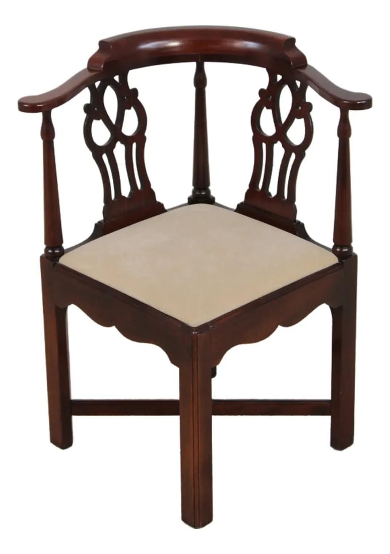Mahogany Corner Chair with Chippendale Inspired Carved Details: Mahogany Corner Chair with Chippendale Inspired Carved Details This Chippendale style corner chair, crafted by Hickory Chair circa 1986, features finely carved mahogany details and a traditional stret