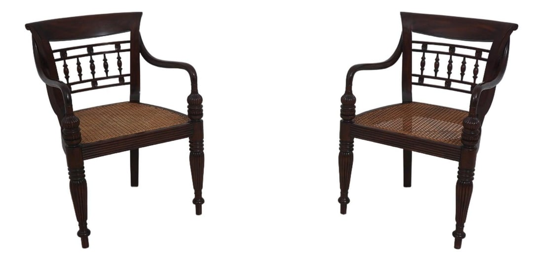Set of Two Carved Mahogany Cane Armchairs Traditional Caribbean Style: Set of Two Carved Mahogany Cane Armchairs Traditional Caribbean Style This pair of mahogany armchairs features finely carved details and a traditional Caribbean style. Each chair is constructed with s