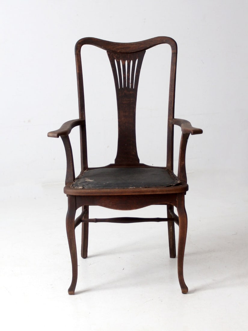 Elegant Antique Victorian Arm Chair Black Upholstered Accent: Elegant Antique Victorian Arm Chair Black Upholstered Accent This Antique Victorian Arm Chair showcases elegant craftsmanship with its graceful lines and intricately carved backrest. Upholstered in bl