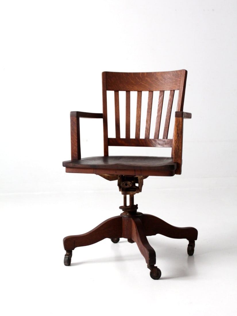 Antique Sikes Oak Desk Chair with Adjustable Height and Casters: Antique Sikes Oak Desk Chair with Adjustable Height and Casters Enhance your workspace with this exquisite antique Sikes oak desk chair, a perfect blend of functionality and style. This chair offers a