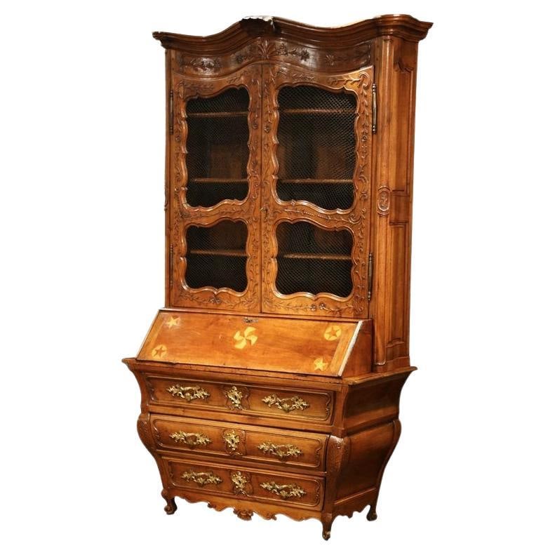 18th Century Louis XV Walnut Secretary Bookcase from Bordeaux: 18th Century Louis XV Walnut Secretary Bookcase from Bordeaux This 18th Century French Louis XV Walnut Secretary Bookcase from Bordeaux is a stunning example of mid-18th century craftsmanship. Crafted