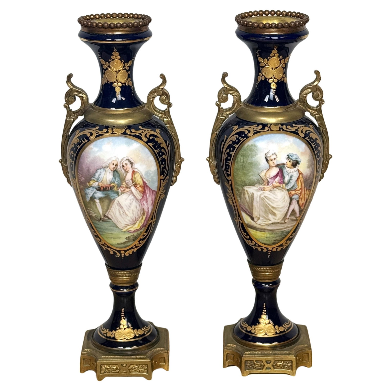 Set of 2 Louis XVI Cobalt Sevres Ormolu Mounted Vases: Set of 2 Louis XVI Cobalt Sevres Ormolu Mounted Vases This exquisite pair of Louis XVI-style cobalt Sevres-style ormolu-mounted vases, crafted in France circa the 1900s, embodies a timeless elegance. 