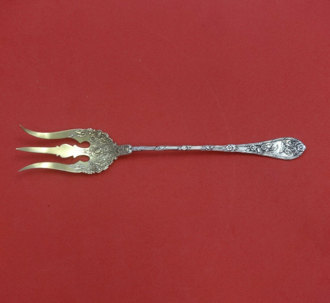 Durgin Dauphin Sterling Silver Lettuce Fork 8 3/4" Gold Wash: Durgin Dauphin Sterling Silver Lettuce Fork 8 3/4" Gold Wash This exquisite Dauphin pattern serving fork from Durgin-Gorham is crafted from sterling silver and features a gold wash finish. Measuring 8