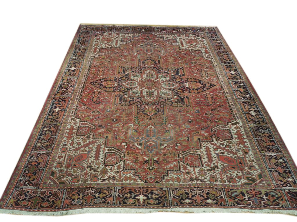 Exquisite 9'10" x 12'6" Semi-Antique Persian Heriz Rug in Rich Red: Exquisite 9'10" x 12'6" Semi-Antique Persian Heriz Rug in Rich Red Free continental US Shipping Enhance your living space with this stunning 9' 10" x 12' 6" Semi-Antique Persian Heriz Rug, meticulousl