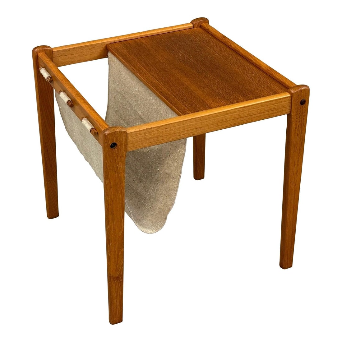 Danish Modern Teak Magazine Rack by BRDR Furbo: Danish Modern Teak Magazine Rack by BRDR Furbo This mid 20th century Danish modern magazine rack features a beautifully crafted teak frame complemented by a sturdy canvas sling. Its elegant design com