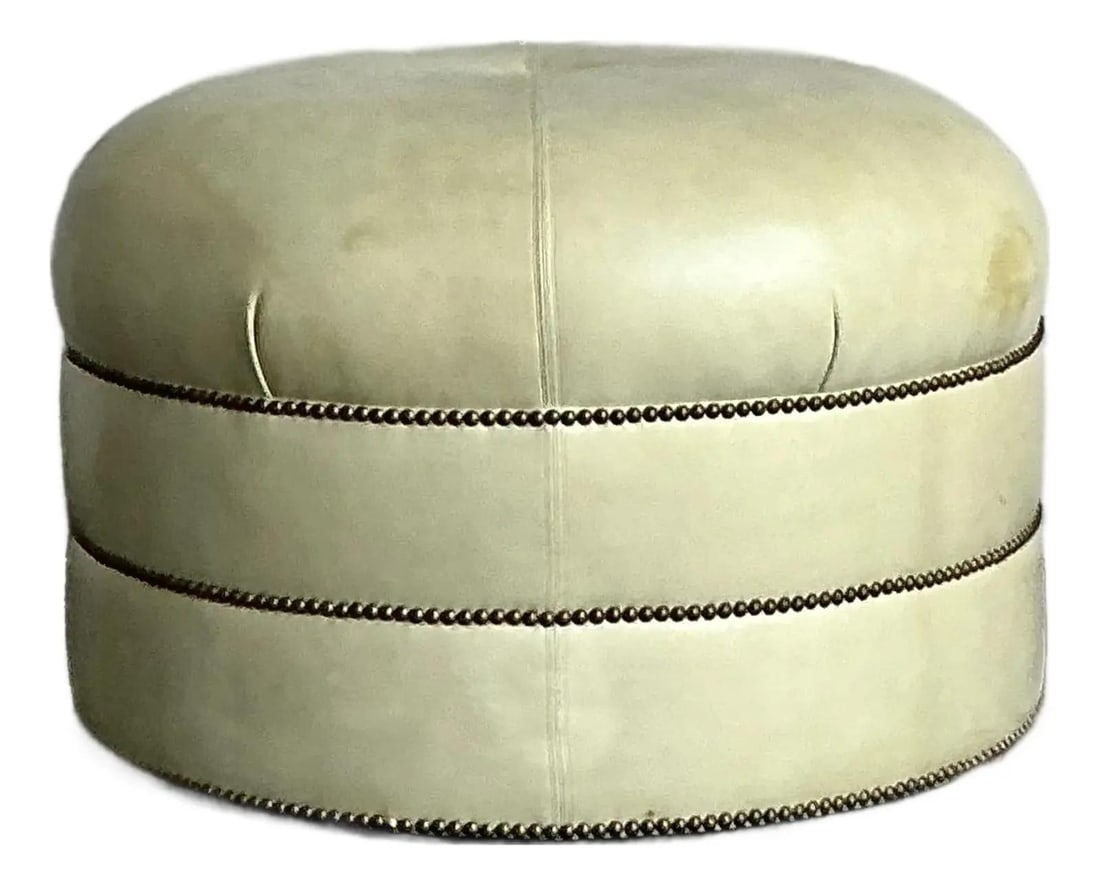 Beige Round Tufted Ottoman with Brass Nailhead Trim 31" Hollywood Regency Style: Beige Round Tufted Ottoman with Brass Nailhead Trim 31" Hollywood Regency Style This vintage round ottoman features a sophisticated tufted design inspired by Art Deco and Hollywood Regency styles. Uph