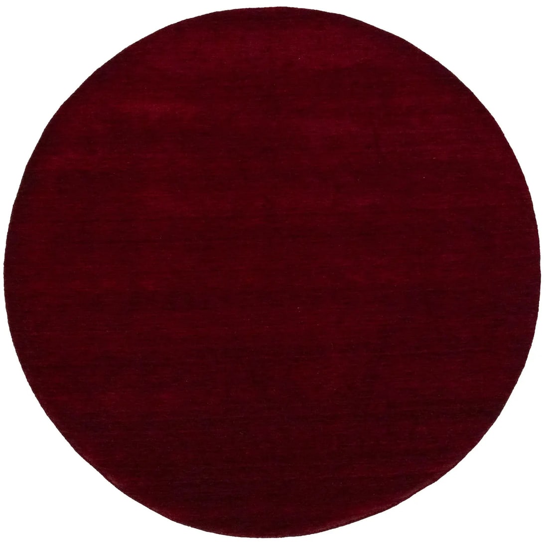 Hand-Loomed Wool Round Rug in Maroon Red Modern Solid Pattern 8x8: Hand-Loomed Wool Round Rug in Maroon Red Modern Solid Pattern 8x8 This hand-loomed round Gabbeh wool rug features a solid maroon red color and a modern design. Crafted in India, it is made from high-q
