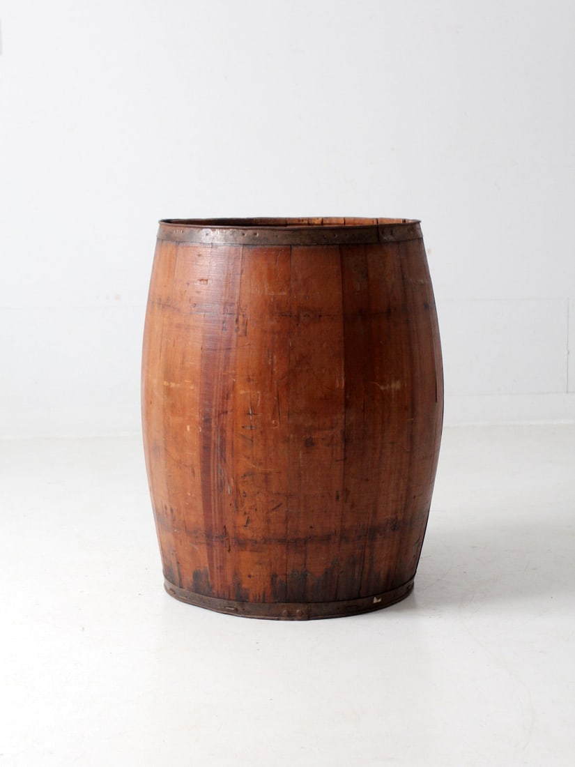 Antique Wood Stave Barrel with Iron Banding 29.25 inches: Antique Wood Stave Barrel with Iron Banding 29.25 inches This antique stave barrel showcases a classic design with wood staves and iron banding at both the top and base. It can function as a charming 