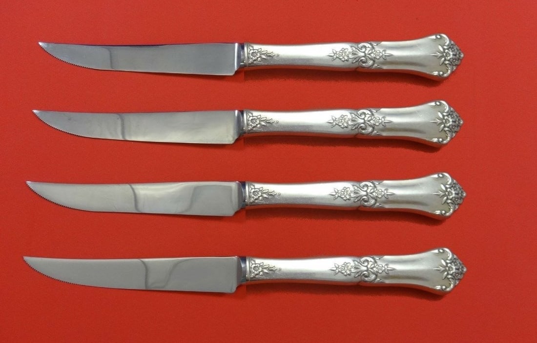 State House Stately Sterling Silver Steak Knife Set 4pc Custom 8.5": State House Stately Sterling Silver Steak Knife Set 4pc Custom 8.5" Enhance your dining experience with this exquisite 4-piece steak knife set from the Stately pattern by State House. Crafted from hig