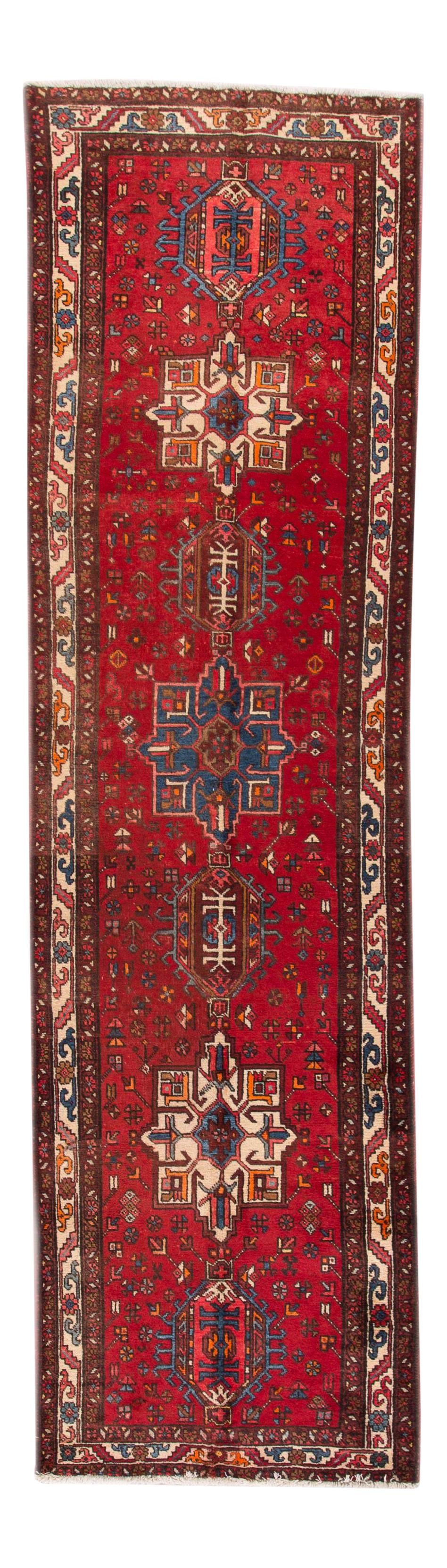 Antique Heriz Handmade Wool Runner Red Geometric 3'3 x 12'8: Antique Heriz Handmade Wool Runner Red Geometric 3'3 x 12'8 This exquisite Antique Heriz Handmade Wool runner showcases a vibrant all-over red field adorned with multi-color accents in a striking geom