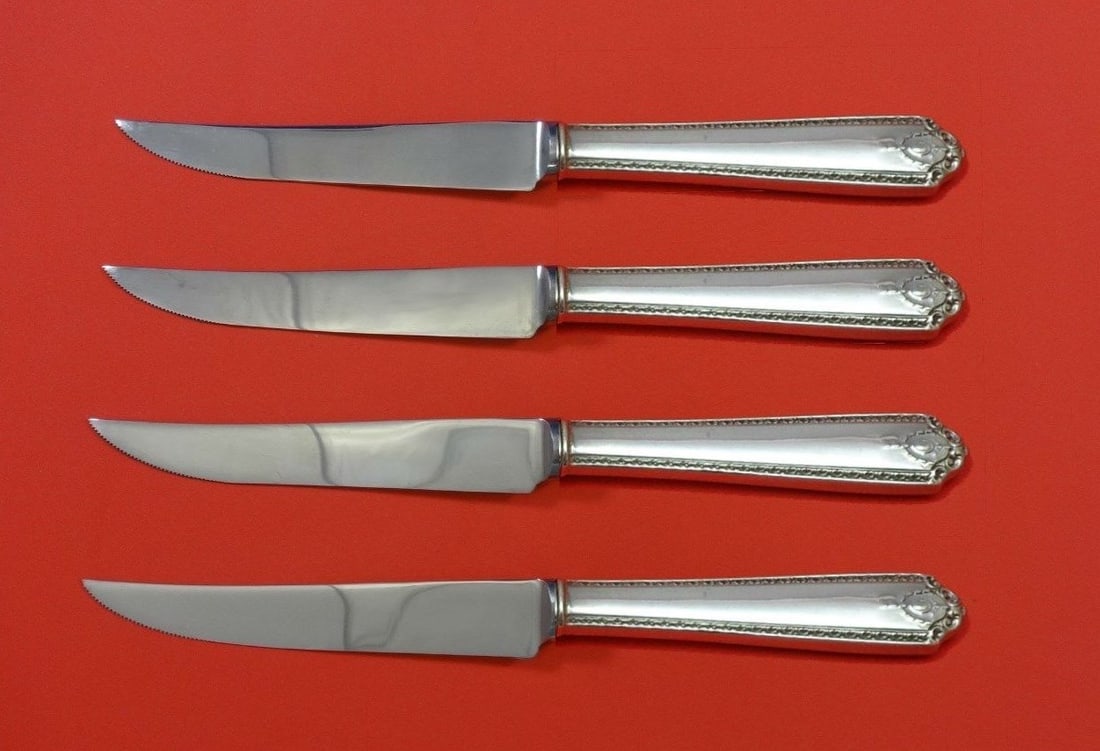 Westmorland Lady Hilton Custom Sterling Silver Steak Knife Set 4pc: Westmorland Lady Hilton Custom Sterling Silver Steak Knife Set 4pc Introducing the exquisite Lady Hilton Sterling Silver Steak Knife Set, crafted by Westmorland. This custom-made 4-piece set features 