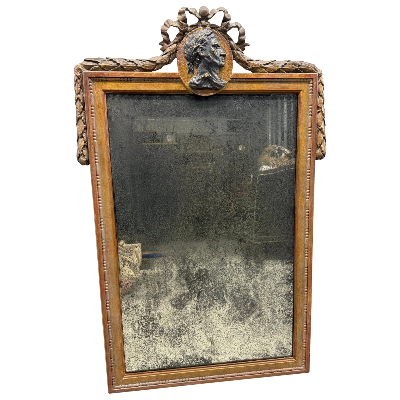 Neoclassical Wall Mirror With Gilt Frame and Classical Medallion Relief: Neoclassical Wall Mirror With Gilt Frame and Classical Medallion Relief This large wall mirror is designed in the neoclassical style, inspired by late 18th-century French Louis XVI models. The rectang