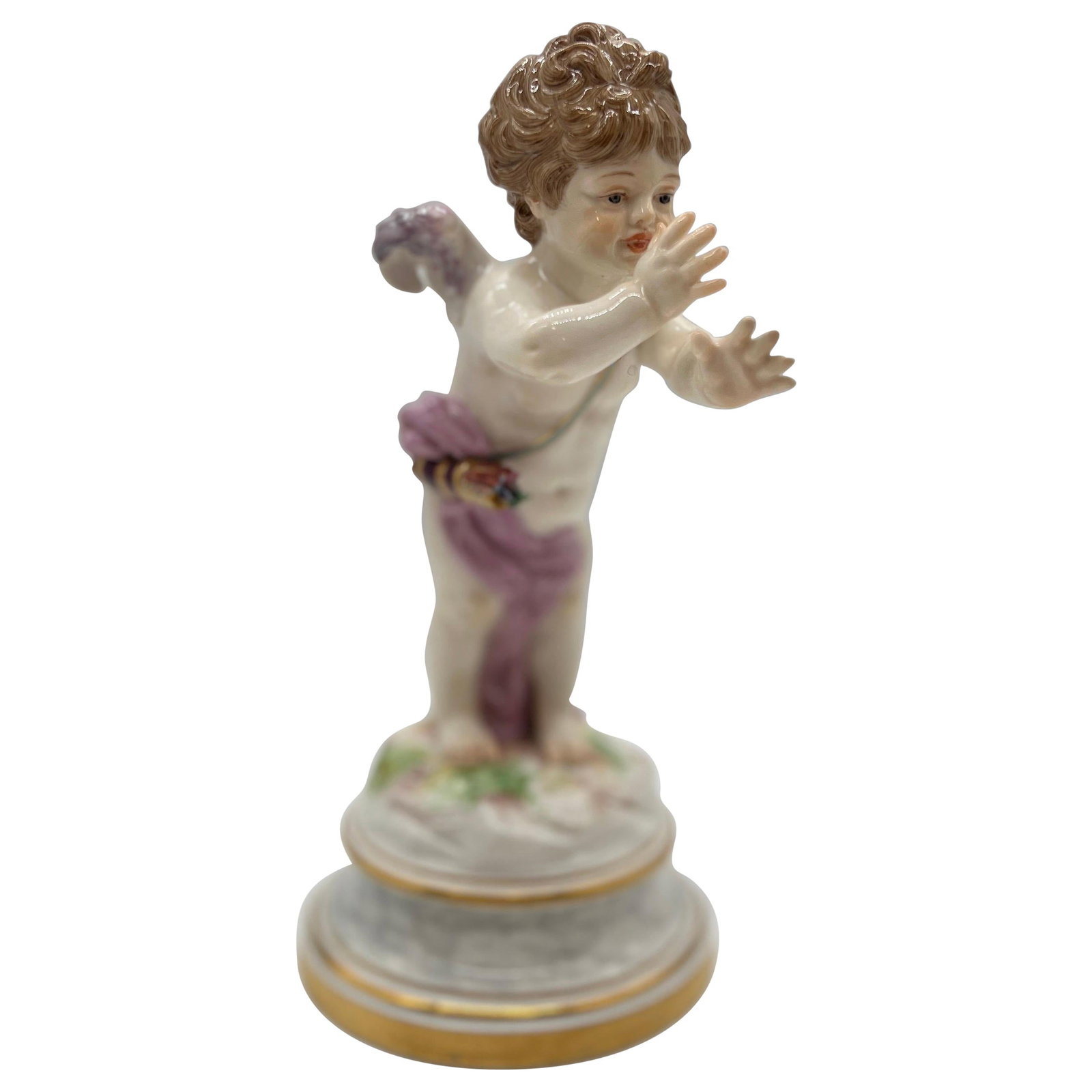 19th Century Porcelain Cupid Figurine Model L125 by Meissen: 19th Century Porcelain Cupid Figurine Model L125 by Meissen This antique Meissen porcelain figure from the 19th century depicts a cupid draped in a purple cloth with delicate wings and lifelike featur